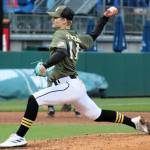 Luke Fenton of the Wolves delivers a pitch from the mound.