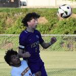 Nicholas Zeller-Singh/Kitsap News Group photos
Viking Harper Sabari leaps over the Kingston defender to head the ball.