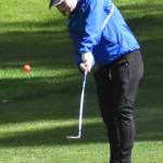 Olympics Kiyomi McKenzie chips the ball.