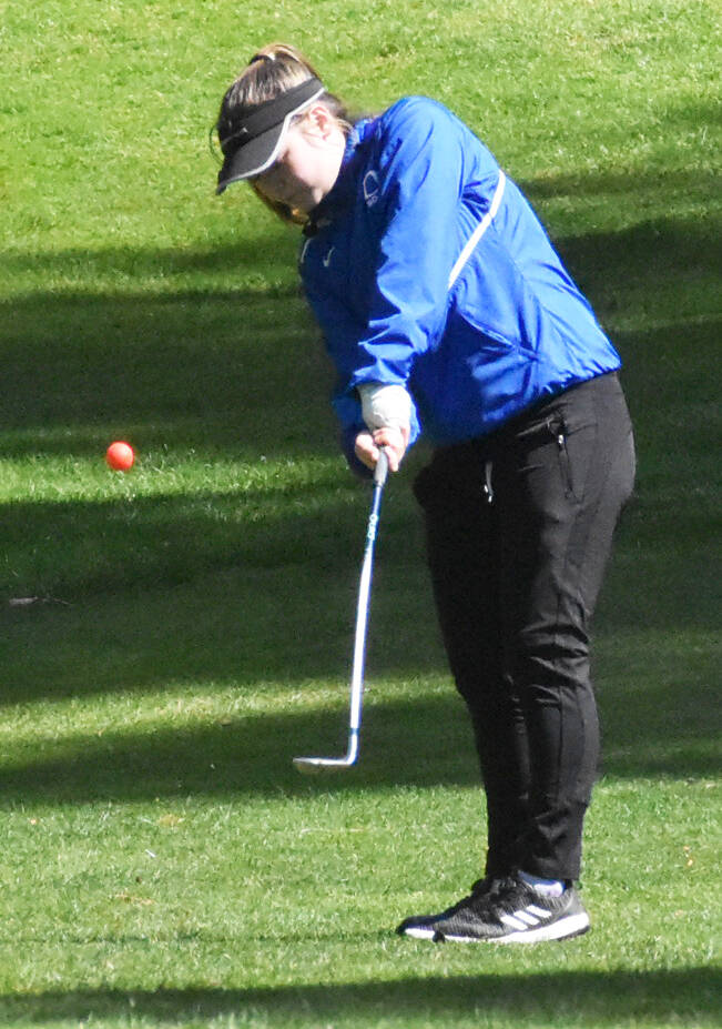 Olympics Kiyomi McKenzie chips the ball.