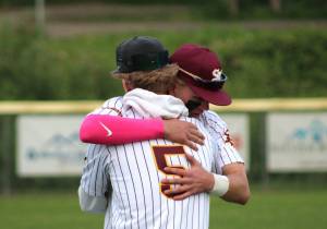 Elisha Meyer/Kitsap News Group photos
Nolan Bayne (5) embraces senior SK teammate Payton Moritz after a home defeat in the district playoffs ends the Wolves season.