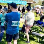 Runners gather around the registration table.