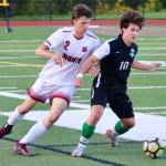 Eagle sophomore Myles Peterson battles for the ball against Montesano.