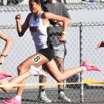 Cougar Maleia Dayao races in the 100 meter.