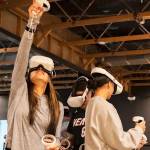 A group plays a game together at Dimension XR.