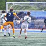 Cruz Piland (9) takes a shot at the goal early in the contest for the Spartans.