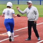 Olympics Evelynne Abbay celebrates while running to first base.