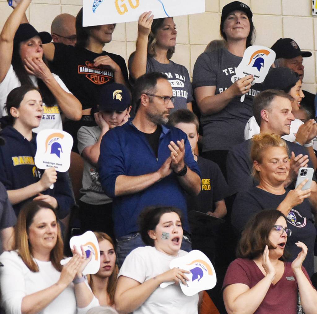 Bainbridge fans celebrate the Spartan water polo squad.