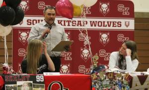 Elisha Meyer/Kitsap News Group
South Kitsap softball coach Bobby Lawrence offers praise for seniors Shelby Avery, left, and Kamdyn Hagerty.