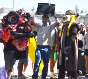 Nicholas Zeller-Singh/Kitsap News Group photos
Noah Sorenson and the mascots celebrate a parade around the school.