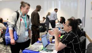 Elisha Meyer/Kitsap News Group
Mharie Collins, left, gathers information on resources available to her for her job hunt.