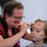 Damon Williams/Kitsap News Group photos
Frida Haas makes Kimberly Wisner a work of art at the Kingston Pirate Festival June 8.