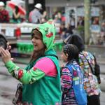 Girl Scouts make their way to the sidewalks to hand out candy.
