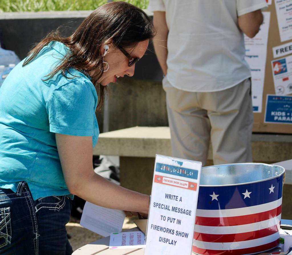 Parade attendees were invited to write a message to be shot into the sky for the nights firework show.