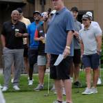 Mike Tice introduces the stars at the tournament, including former Husky and Seahawk great Warren Moon, left.
