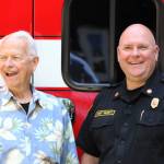 Elisha Meyer/Kitsap News Group photos
Robert Roblee, left, stands beside SKF&R fire chief Jeff Faucett in front of the donated ambulance honoring himself and his late life partner Ron Johnson.