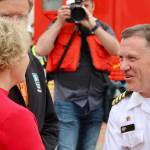 Capt. Daryle Cardone, commanding officer of the USS Ronald Reagan, is greeted by city and county officials upon his arrival to Bremerton.