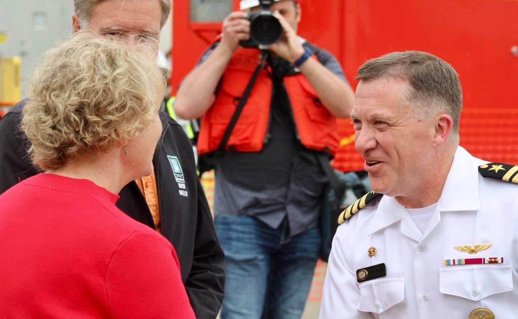 Capt. Daryle Cardone, commanding officer of the USS Ronald Reagan, is greeted by city and county officials upon his arrival to Bremerton.