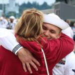 Elisha Meyer/Kitsap News Group photos
Adam Lachman is wrapped in an embrace by family upon his arrival to Bremerton aboard the USS Ronald Reagan.