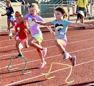 BI Kiwanis courtesy photos
Young girls jump over small hurdles in one of the events.
