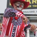The rodeo clown makes his way into the stands, to the delight of some in the audience.