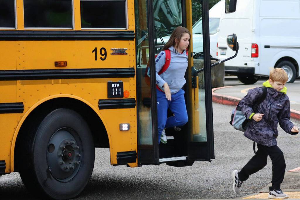 These students are eager to get off the bus in anticipation of the first day of school Aug. 27.