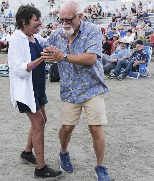 A couple gets into the groove at Thunderbird Stadium.