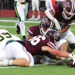 Senior Decan Mulligan-Bowers makes a grab at a Kentridge fumble in the first quarter.