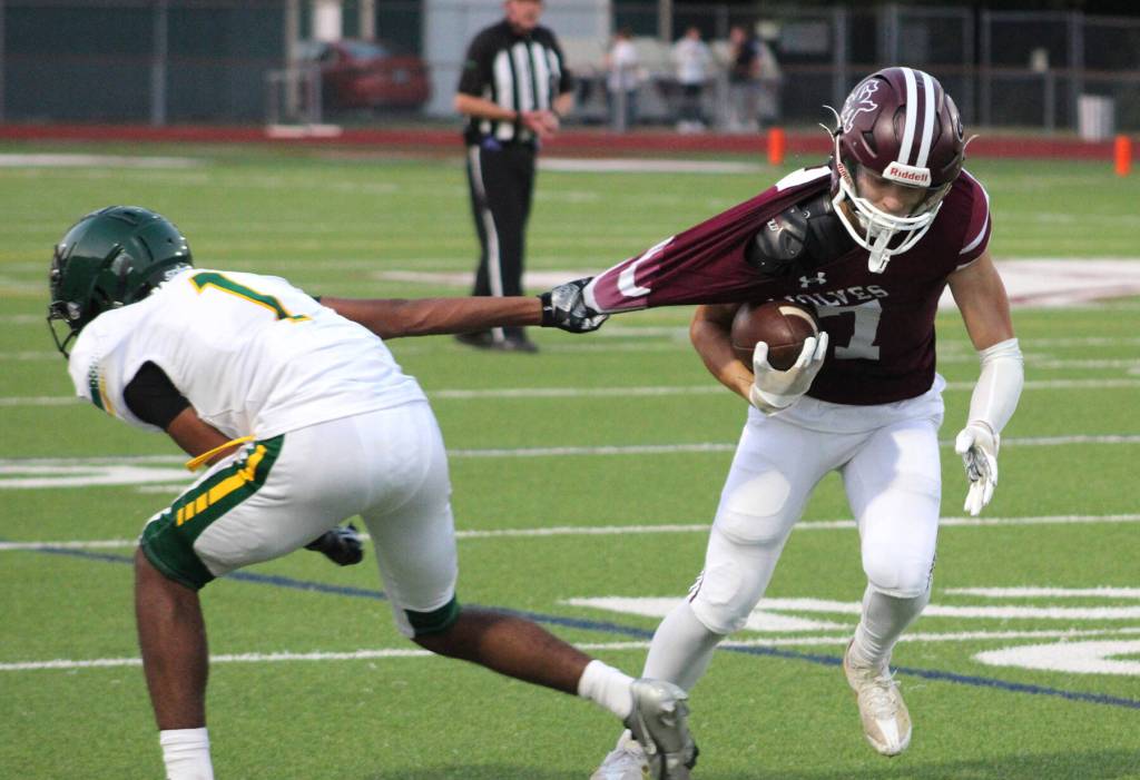 Senior wide receiver Noah Porter fights through a tackle.