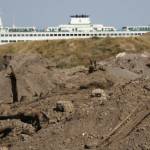 Molly Hetherwick/Kitsap News Group photos
A few large piles of creosote-contaminated dirt frame the future view from Pritchard Park, while a ferry arrives in Bainbridge.