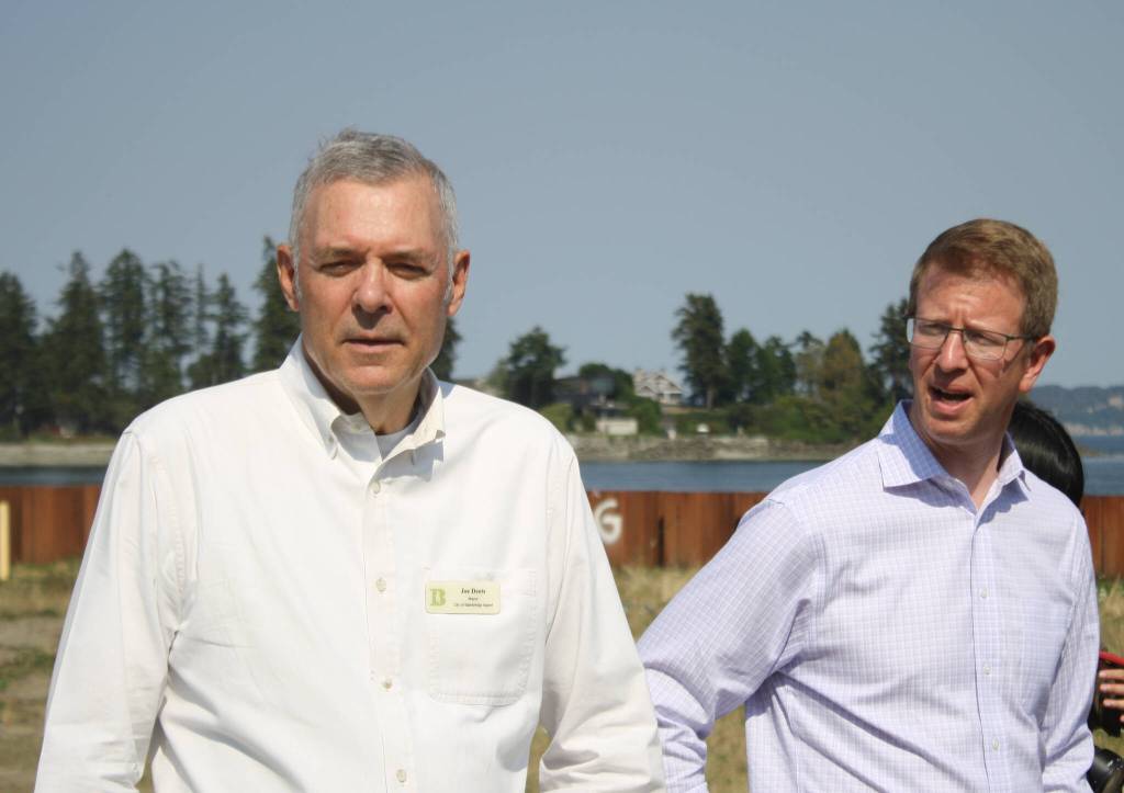 BI Mayor Joe Deets and U.S. Rep. Derek Kilmer listen to details about Wyckoff operations.