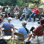 A circle of banjo players partake in a class at the American Banjo Camp.