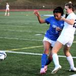 Sam Donlon, right, gets rid of the ball just as Olympic senior Jenya Kelley reaches her.