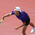 Viking Spencer Gillespie makes a serve in a doubles match against Kingston.