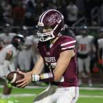 Junior SK quarterback Franklin Fox goes to hand off the ball to a running back against Central Kitsap.