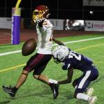 Kingston senior Kyler Hedstrom searches for a flag on an incomplete pass.
