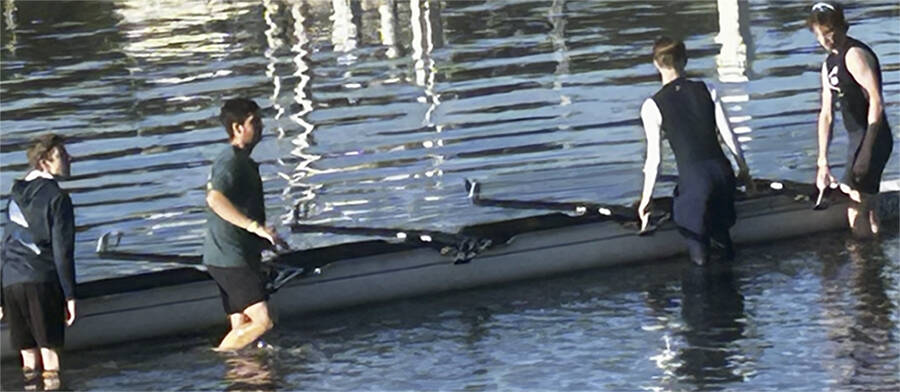 A four-person crew puts their shell in the waters of Eagle Harbor.