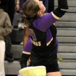 NK senior Teegan DeVries goes up for a two-handed attack at the net.