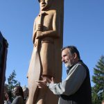 Leonard Forsman, chairman of the Suquamish Tribe since 2005, applauds a speech in front of Shweabe.