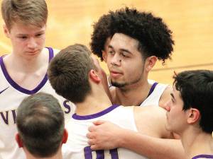 File photo
Shaa Humphrey is congratulated by teammates after reaching the 1,000-point milestone for North Kitsap as a senior. He is now the Vikings head coach.