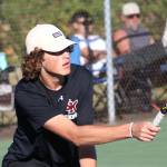 Elisha Meyer/Kitsap News Group photos
SK senior Sam Colson goes low to get his racket on the ball.