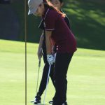 Junior Leiana Champaco follows through on a putt at the 18th green to close out Day 1 at Gold Mountain Golf Club.