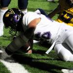 North Kitsap senior Carter Dungy rolls down just shy of the goal line against the Bainbridge Spartans.