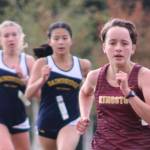 Sophia Brown of Kingston tries to stay ahead of a pair of Bainbridge runners in the final sprint of her 5K race.