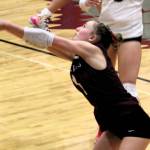 SK sophomore libero Payton Elmore bumps a ball into the air to her setter.