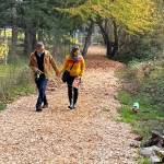 A couple walk their dog along the new trail.