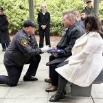 Bergeron family courtesy photos
Bill Bergeron Jr. receives a U.S. flag at a military funeral for his father.