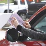 Molly Hetherwick/Kitsap News Group
A voter puts her election ballot in a drop box on Bainbridge Island Nov. 5.