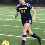 Bainbridge senior Grace Rich dribbles down the field in the first half of a match with Kingston.