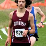 South Kitsap junior Isaac Benjamin tries to keep an approaching runner behind him at districts Nov. 2.
